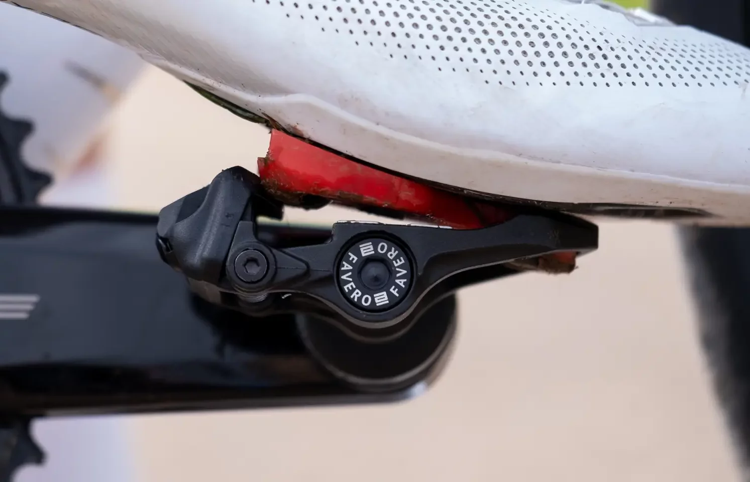 A close up image of a cyclist clipping into a Favero Assioma power meter pedal.